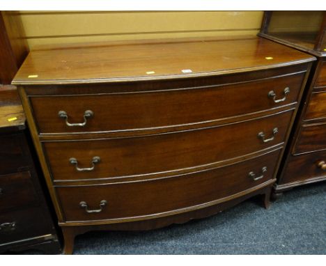 A reproduction mahogany bow fronted three-drawer chest of drawers. Height - 92cms, depth - 56cms, length - 116cms