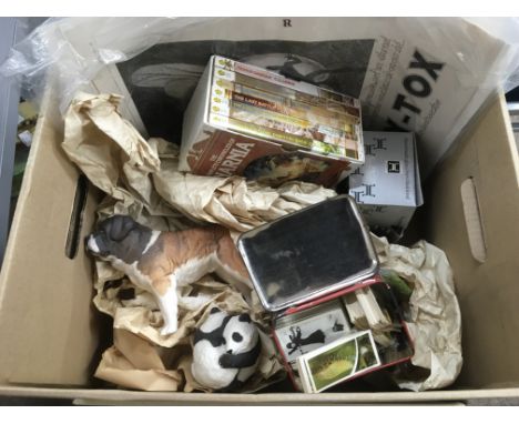A box containing oddments including ceramic figures, tea cards etc.