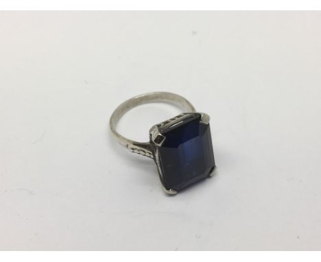 A 1930s platinum or white gold ring set with a good sized sapphire, approx 4.4g and approx size K.