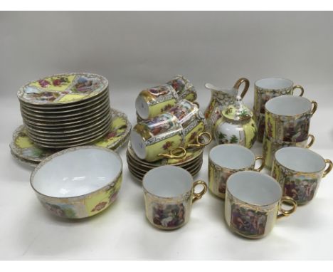 A decorative porcelain 12 place setting tea, coffee and dinner service.