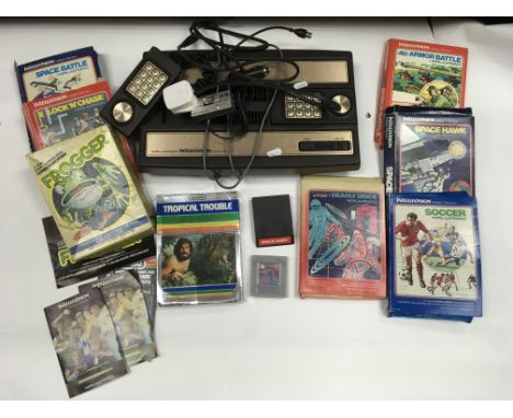 A vintage Mattel Intellivision gaming console plus some games including Tron