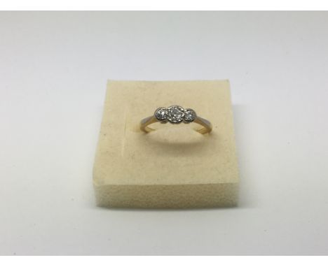 An 18ct gold ring set with three small diamonds, approx 2.3g and approx size K-L.