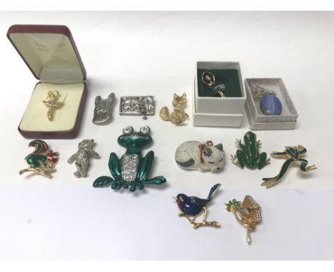 A collection of costume jewellery, enamel brooches and Swarovski.