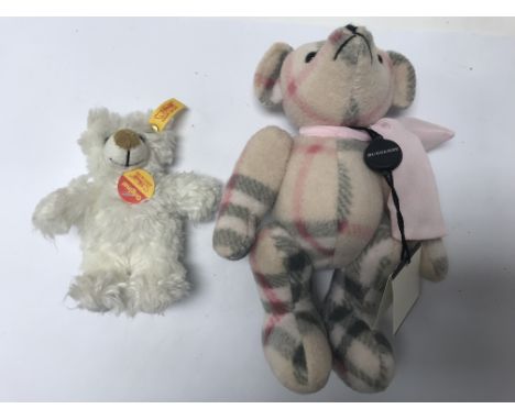 A small Burberry teddy together with a small Steiff bear.