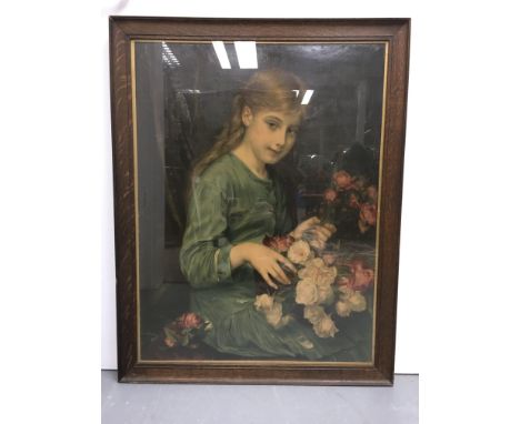 A framed and glazed portrait print of a young girl holding a bouquet of pink and white flowers, frame measures approximately 