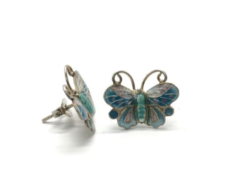 A pair of silver and blue enamel butterfly stud earrings.