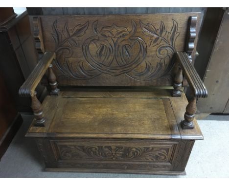 A carved oak Monk's bench with drop back Approx 47.x1012x100cm high