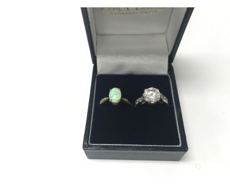 A pair of 9ct gold rings; one being CZ and the other an opal. Weight approx 3.77g, sizes approx K/L.