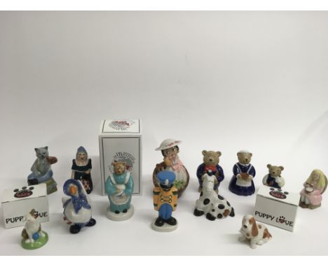 A collection of assorted Wade figures including 'Betty Boop' and 'Goldilocks and the Three Bears'