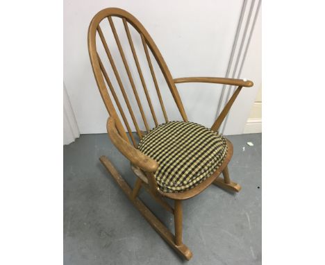 An Ercol light elm rocking chair