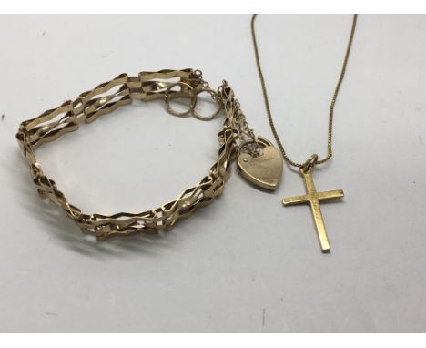 A 9carat gold gate bracelet with a padlock clasp and a gold cross with chain. Weight 9g. (2)