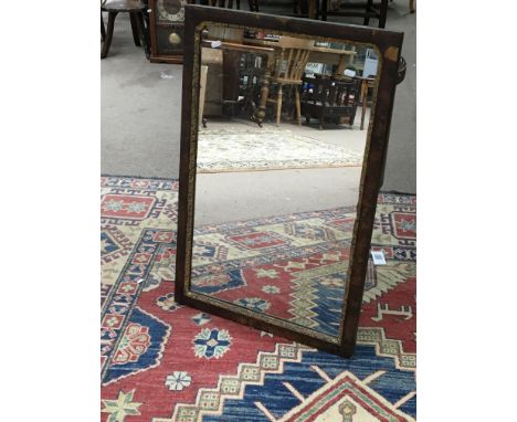 A George II walnut and gilt wood wall mirror of rectangular shape.
