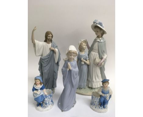 A large NAO 'Mother and Child' figure, another of a Jesus, one other, and a pair of 19th century bisque match strikers