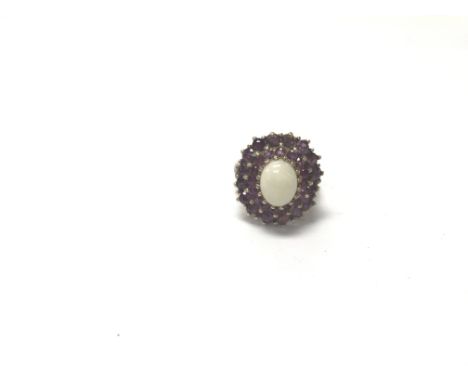 A 9ct gold opal and ruby ring. Weight approx 7.39g, size approx P.