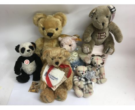 A group of collector's bears comprising a Steiff panda and multi coloured bear with others by Merrythought, Hummel and Burber