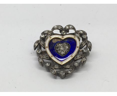 A Victorian, gold back heart shape brooch having blue enamel front inset with old cut diamonds in openwork diamond surround, 