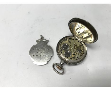 A small silver fob watch with a silver medal. Weight approx 27.69g