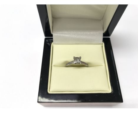 A single stone diamond, platinum and white gold ring. Weight approx 3.51g, size approx M.