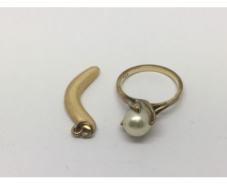 A 9ct gold ring set with a pearl, approx size J-K, plus a gold boomerang pendant, approx total weight 5.7g.