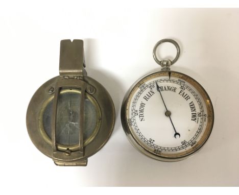 A chrome pocket barometer and a military compass, marked to the reverse T G Co Ltd, London, No B282206, 1944, MKIII, some dam