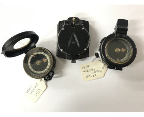 Three compasses to include Barker Military compass and others