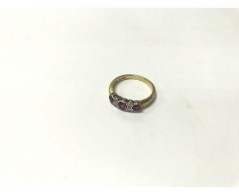 An 18ct gold, ruby and diamond ring. Size approx P, weight approx 4.29g