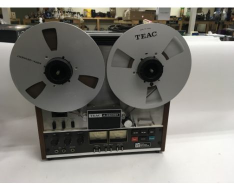 A Teac record to record player, measuring approximately 44cm by 44cm.