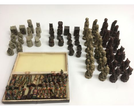 Three sets of  chess pieces comprising a pottery Tremar type  set, a painted ceramic set and a resin Chinese style example