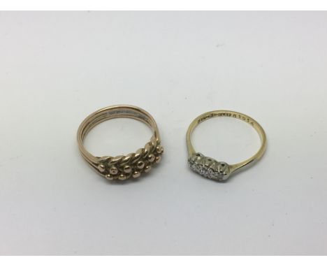 A gold keeper ring and one other 18ct gold ring set with diamonds, total approx weight 4.8g and approx sizes J-K and L.