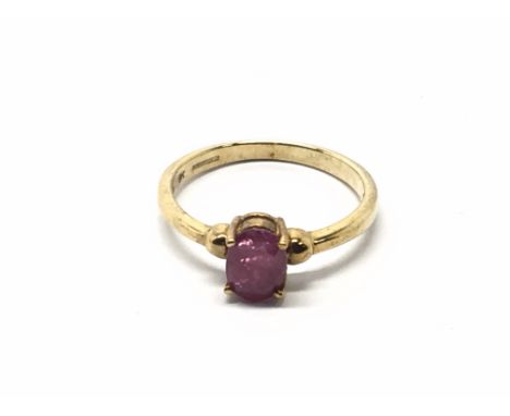 A 9cart gold ring set with a solitaire ruby. Ring size N.