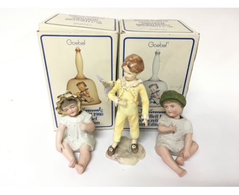 Two boxed Goebel ceramic bells, a Royal Worcester figure modelled by Francis Doughty and two nodding ceramic figures.