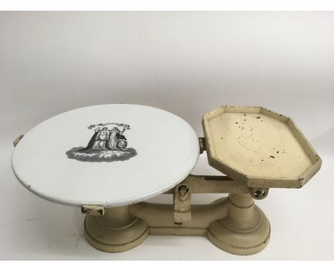 A set of of metal scales wiith printed ceramic top.