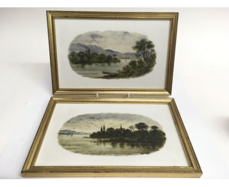 Two painted, framed  ceramic plaques depicting tranquil lake landscapes.Approx 20x30cm
