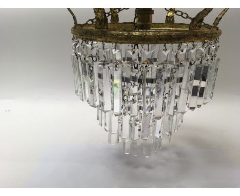 Another brass three tier chandelier with cut glass drops.