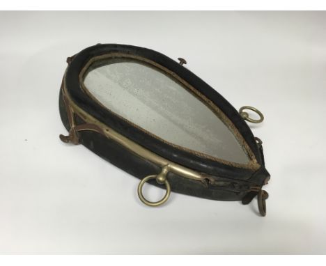 An antique horse collar mirror with brass hangers and original mirror. Approximately 67cm tall.