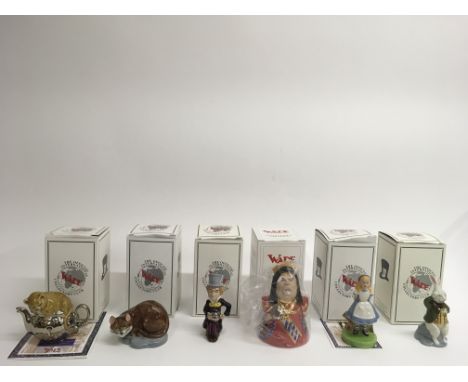 A set of six Wade Collector's Club 'Alice in Wonderland' figures, boxed.