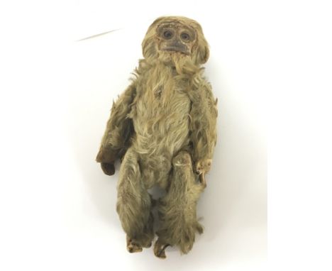 An unusual Vintage monkey figure with detachable Head enclosing a screw cap hip flask.