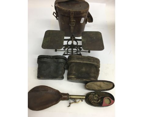 Three pairs of binoculars a powder flask and set of scales