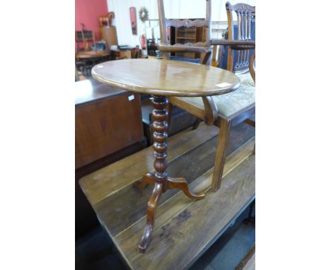 A Victorian mahogany oval tilt-top tripod table 