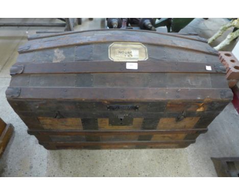 A domed top steamer trunk 