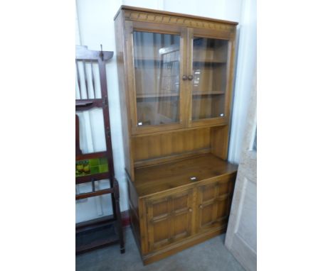 An Ercol Golden Dawn bookcase 
