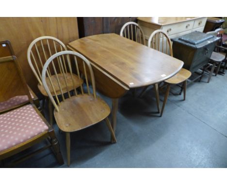 An Ercol Blonde drop-leaf table and four chairs 
