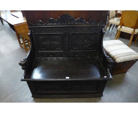 A 17th Century carved oak monk's bench 
