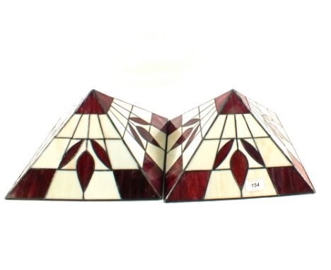 A pair of red and white Tiffany style lamp shades