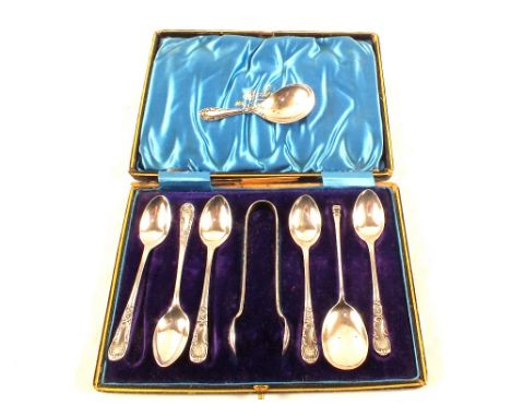 A cased set of six spoons and tongs (one spoon missing) together with a single Silver seal top spoon and a Silver caddy spoon