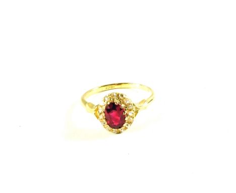 An 18ct Gold Ruby and Diamond cluster ring, size N