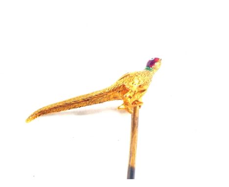 A yellow metal stick pin set with pheasant with enamelled head