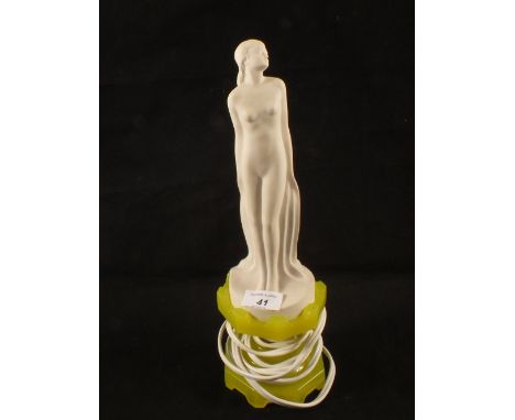 A USA Cadnium glass table lamp with a USA Belleek standing lady shade, figure marked 3369, c1925, height 14"