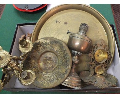 A box of Brass ware to include an oil lamp, candelabra etc