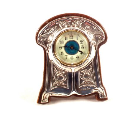An Art Nouveau Silver clock with floral decoration and Turquoise enamel dial, Walker & Hall, Sheffield 1906